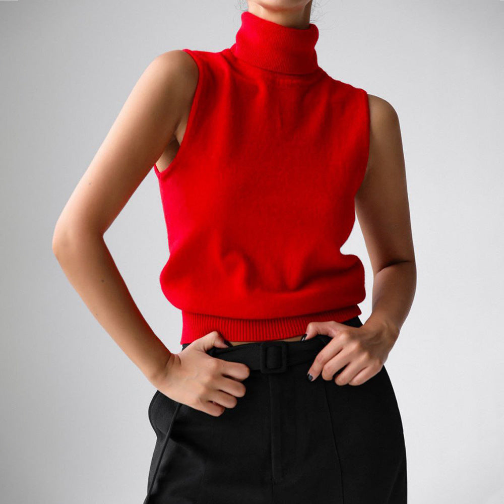 Sleeveless knit top for women featuring a soft turtleneck design and ribbed hem, perfect for layering or wearing alone. 4