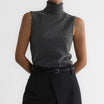 Sleeveless knit top for women featuring a soft turtleneck design and ribbed hem, perfect for layering or wearing alone. 5