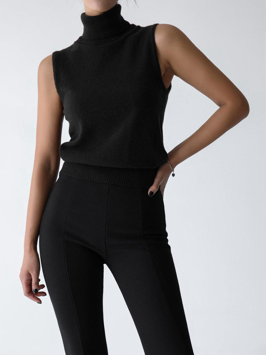 Sleeveless knit top for women featuring a soft turtleneck design and ribbed hem, perfect for layering or wearing alone. 7