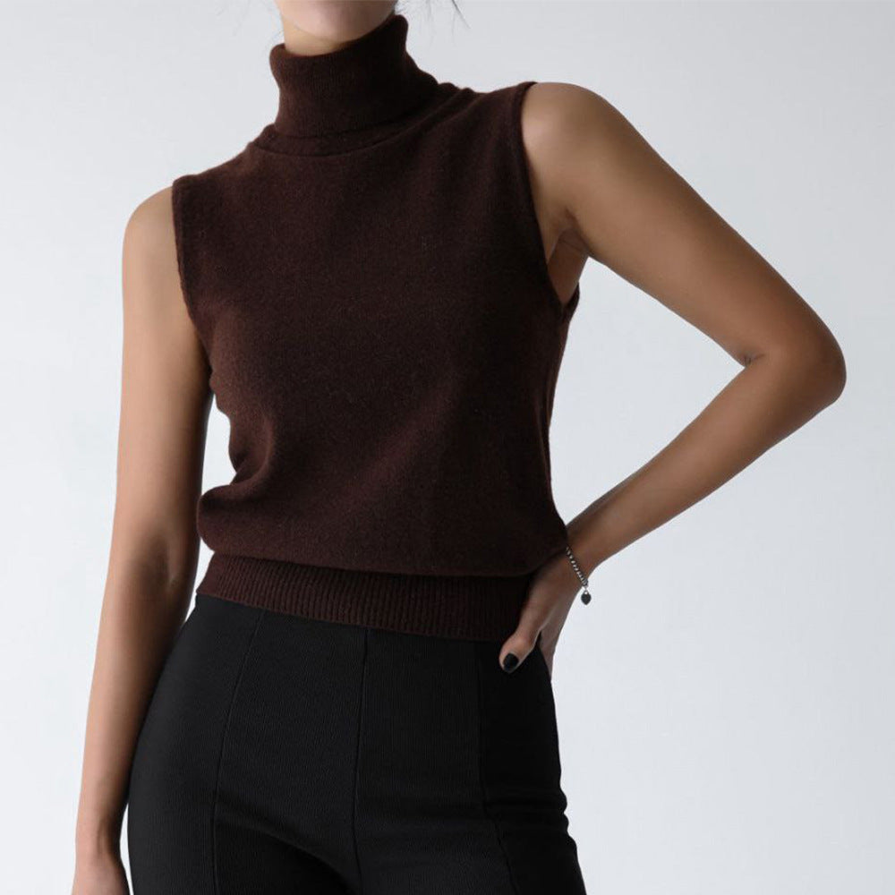 Sleeveless knit top for women featuring a soft turtleneck design and ribbed hem, perfect for layering or wearing alone. 8