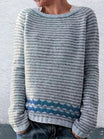 Striped knit sweater featuring a relaxed fit and a two-tone design with a patterned hem, perfect for casual wear and hip-length styling. 1