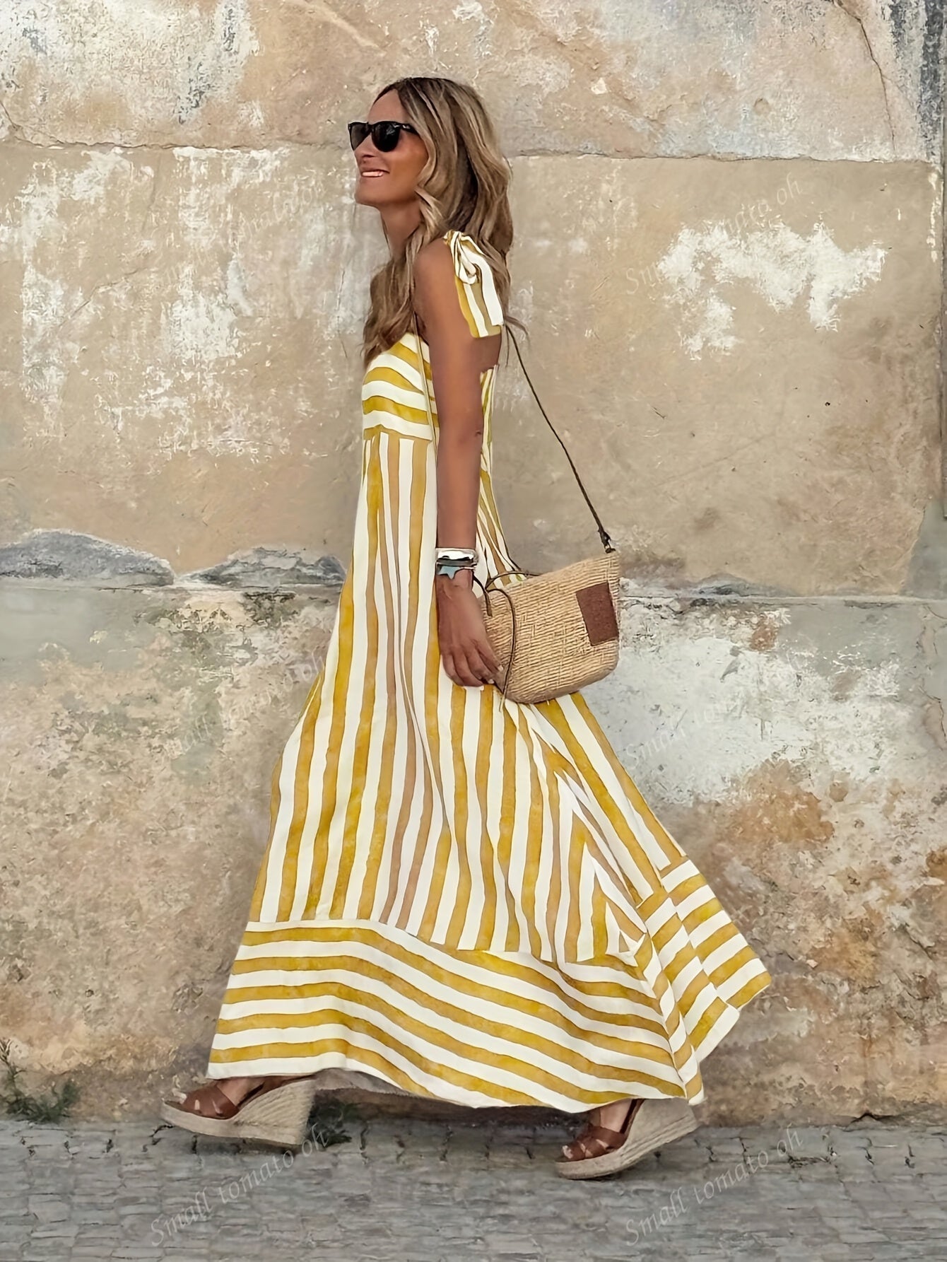 Elegant striped maxi dress featuring adjustable tie straps and a flowing full skirt, perfect for women seeking stylish and comfortable summer wear. 4