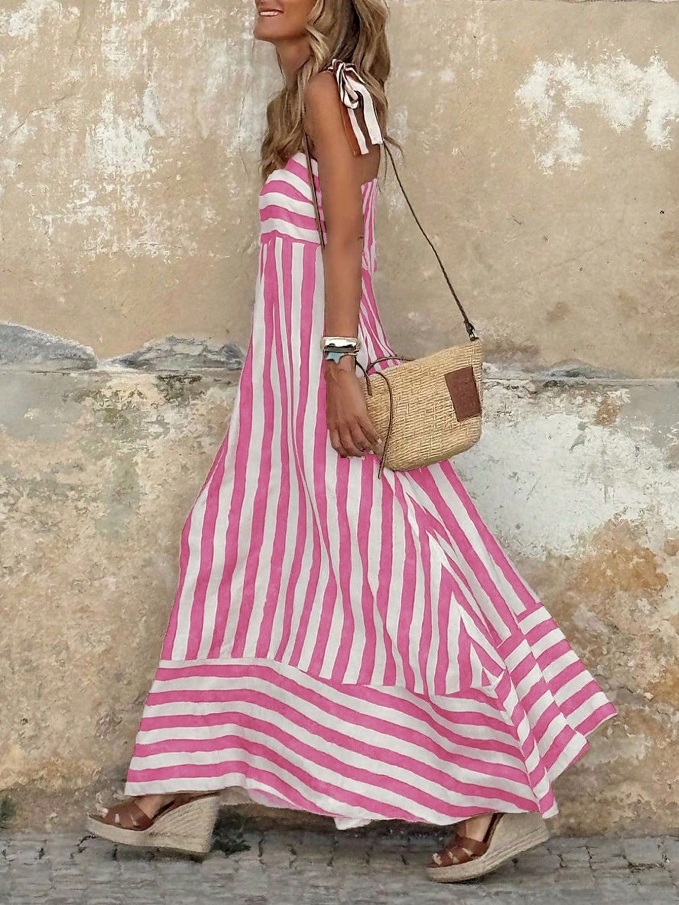 Elegant striped maxi dress featuring adjustable tie straps and a flowing full skirt, perfect for women seeking stylish and comfortable summer wear. 6