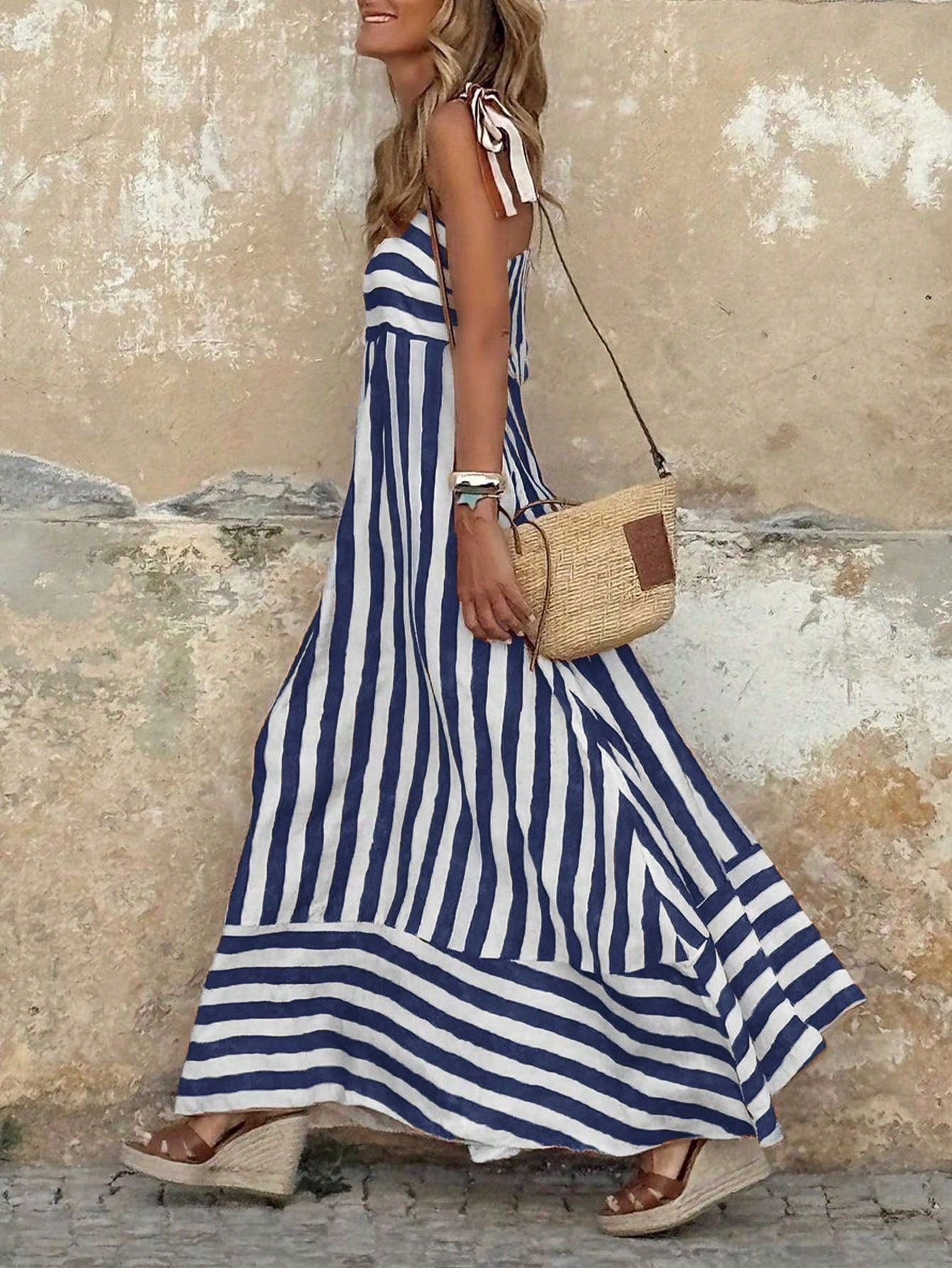 Elegant striped maxi dress featuring adjustable tie straps and a flowing full skirt, perfect for women seeking stylish and comfortable summer wear. 7