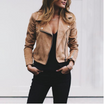 Suede biker jacket for women featuring an asymmetric zip, lapel collar, and cropped fit, perfect for a stylish motorcycle look. 1