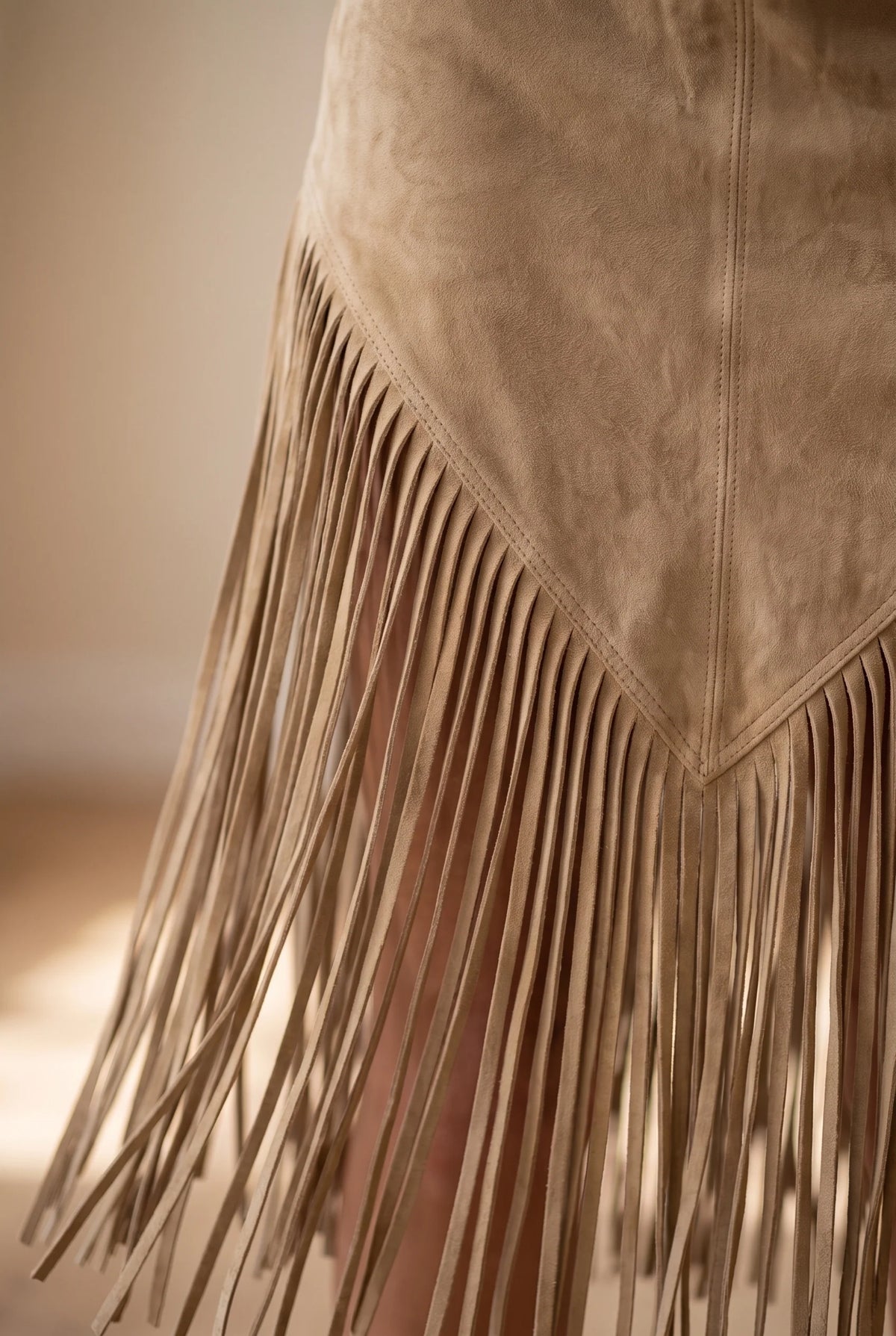 Suede fringed dress with edgeless neckline in four colors, showcasing a chic and stylish design perfect for any occasion. 3