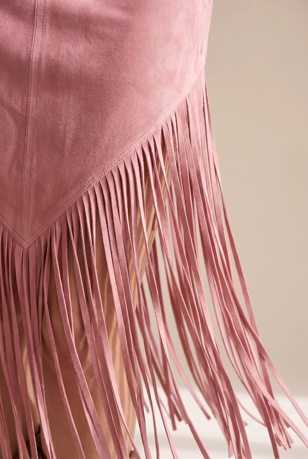 Suede fringed dress with edgeless neckline in four colors, showcasing a chic and stylish design perfect for any occasion. 7