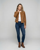 Tan suede jacket featuring a gold button front and a stylish collarless neckline, designed in a cropped tailored fit for a chic, modern look. 1