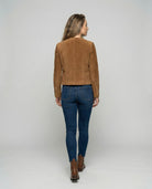 Tan suede jacket featuring a gold button front and a stylish collarless neckline, designed in a cropped tailored fit for a chic, modern look. 2