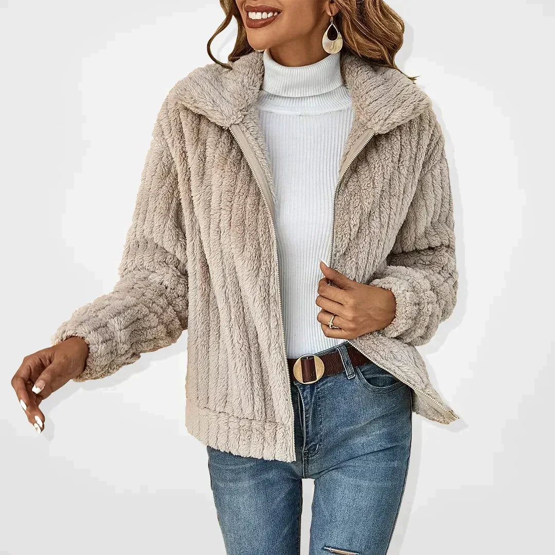 Cozy teddy fleece jacket with zip front and fold-over collar in a relaxed fit cropped style, perfect for layering in cooler weather. 0