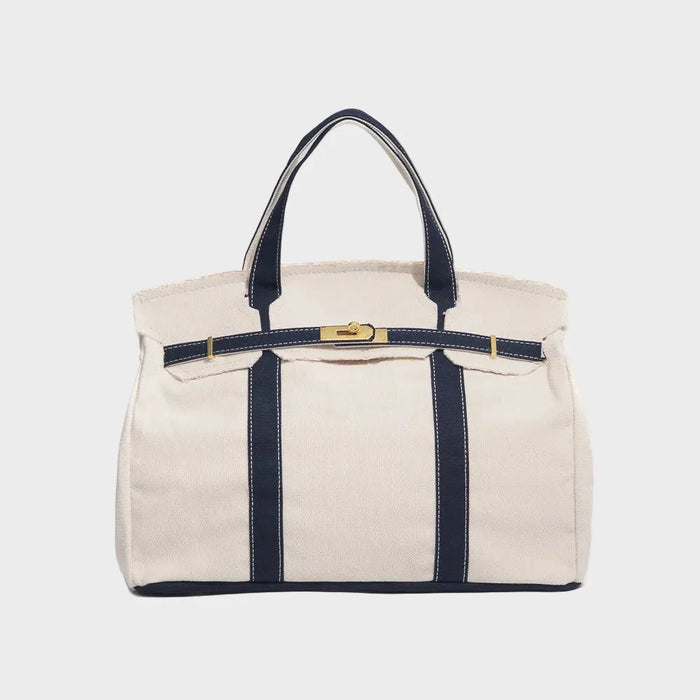 Vintage linen canvas tote bag featuring reinforced handles and a secure snap closure, designed for water resistance and ample space, perfect for everyday use. 0