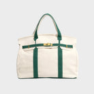 Vintage linen canvas tote bag featuring reinforced handles and a secure snap closure, designed for water resistance and ample space, perfect for everyday use. 1