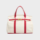 Vintage linen canvas tote bag featuring reinforced handles and a secure snap closure, designed for water resistance and ample space, perfect for everyday use. 3