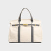 Vintage linen canvas tote bag featuring reinforced handles and a secure snap closure, designed for water resistance and ample space, perfect for everyday use. 4