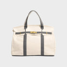 Vintage linen canvas tote bag featuring reinforced handles and a secure snap closure, designed for water resistance and ample space, perfect for everyday use. 4