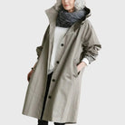Waterproof trench coat for women featuring an adjustable belt, designed as a long raincoat in a timeless style for ultimate protection against the elements. 0