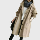 Waterproof trench coat for women featuring an adjustable belt, designed as a long raincoat in a timeless style for ultimate protection against the elements. 3