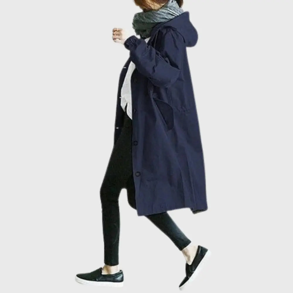 Waterproof trench coat for women featuring an adjustable belt, designed as a long raincoat in a timeless style for ultimate protection against the elements. 4