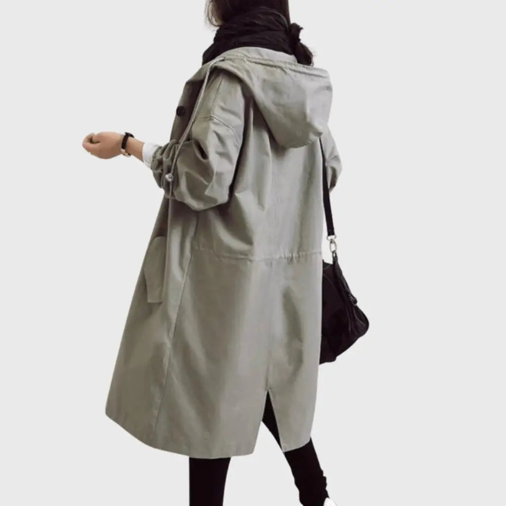 Waterproof trench coat for women featuring an adjustable belt, designed as a long raincoat in a timeless style for ultimate protection against the elements. 6