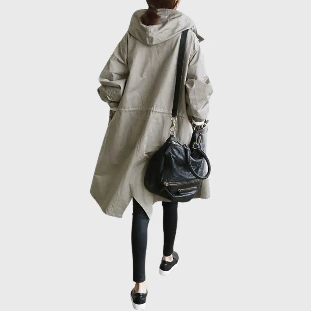 Waterproof trench coat for women featuring an adjustable belt, designed as a long raincoat in a timeless style for ultimate protection against the elements. 7