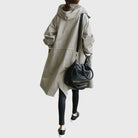Waterproof trench coat for women featuring an adjustable belt, designed as a long raincoat in a timeless style for ultimate protection against the elements. 7