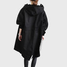 Waterproof trench coat for women featuring an adjustable belt, designed as a long raincoat in a timeless style for ultimate protection against the elements. 8