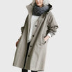 Waterproof trench coat for women featuring a hood and adjustable belt, ideal for stylish protection against rain. 0