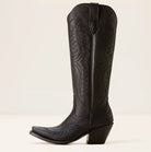 Western boot featuring a sculpted heart design and metal stud embellishments, crafted in a sleek raven leather finish. 0