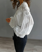 Elegant white blouse featuring a scalloped floral neckline and long lantern sleeves, perfect for summer outings and casual chic outfits for women. 5