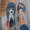 White flat sandals for women featuring a stylish metal buckle, designed for comfort and easy slip-on wear, perfect for summer outings. 0