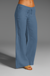 Wide leg linen trousers with drawstring waist, featuring a relaxed fit for women, perfect for casual outings in natural linen fabric. 5
