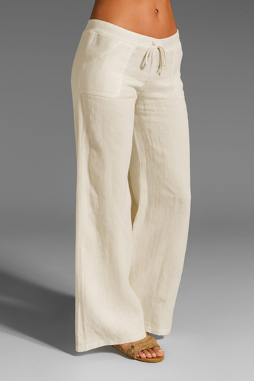 Wide leg linen trousers with drawstring waist, featuring a relaxed fit for women, perfect for casual outings in natural linen fabric. 6