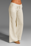 Wide leg linen trousers with drawstring waist, featuring a relaxed fit for women, perfect for casual outings in natural linen fabric. 6