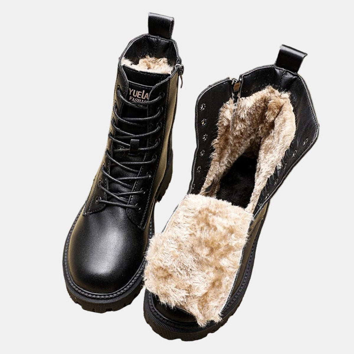 Women's black faux leather ankle boots featuring a cozy fur lining and stylish lace-up closure, perfect for winter fashion and comfort. 0