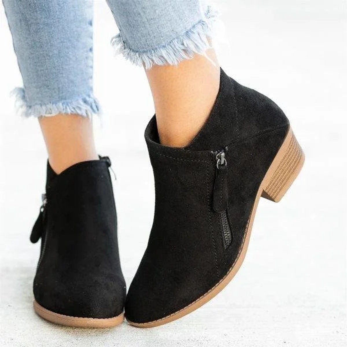 Black suede women's ankle boots featuring a stylish side zipper and a comfortable low block heel, perfect for casual and chic outfits. 5