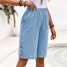 Women's Bermuda shorts featuring a high-rise elastic waist and relaxed fit, designed with lightweight fabric and stylish button details for a comfortable and trendy summer look. 0