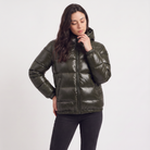 Women's black puffer jacket featuring a stylish attached hood, glossy quilted design, and convenient zip pockets, designed for a relaxed fit perfect for winter wear 1