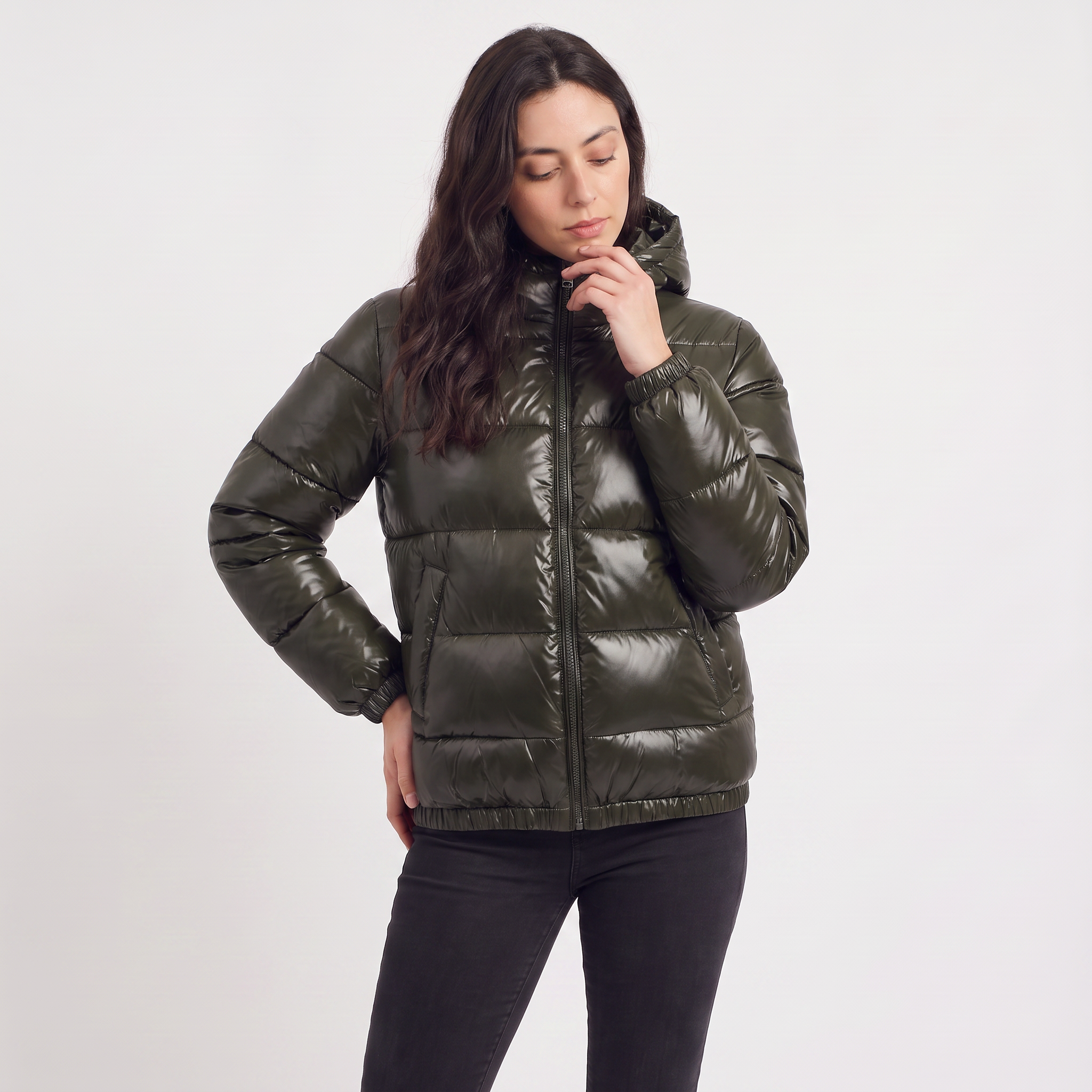 Women's black puffer jacket featuring a stylish attached hood, glossy quilted design, and convenient zip pockets, designed for a relaxed fit perfect for winter wear 1