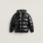 Women's black puffer jacket featuring a stylish attached hood, glossy quilted design, and convenient zip pockets, designed for a relaxed fit perfect for winter wear 7