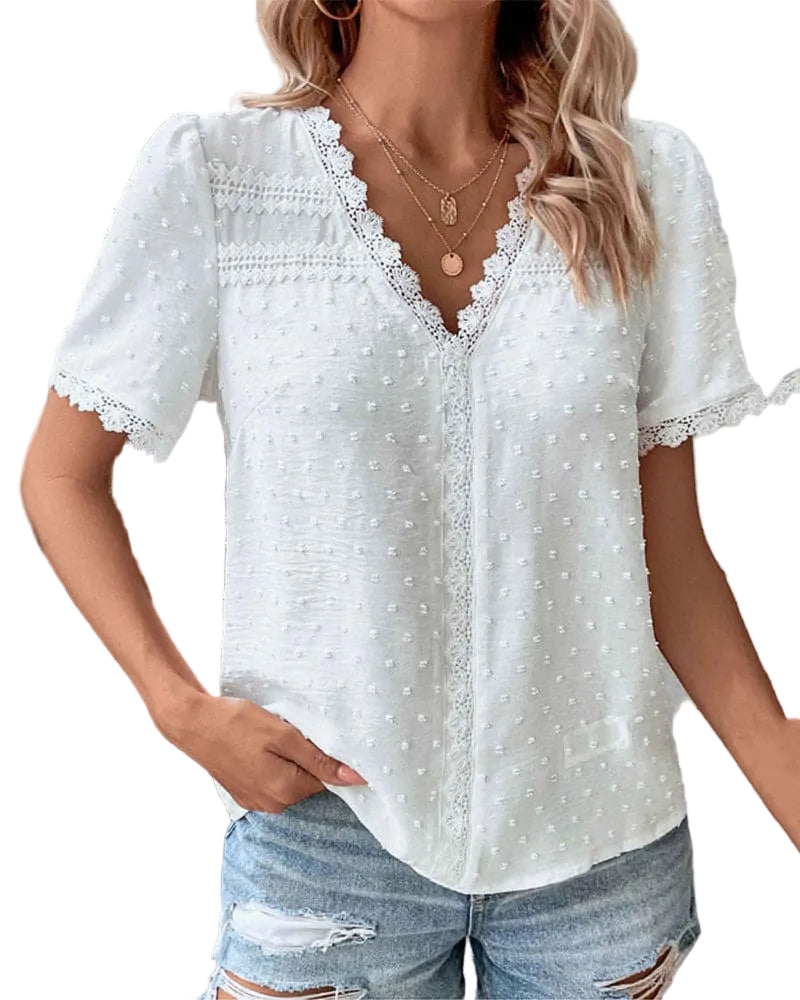 Women's white Swiss dot blouse featuring decorative trim, a stylish V-neck design, and short sleeves, perfect for summer wear. 1