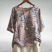 Women's lightweight summer blouse featuring a vibrant floral print, relaxed fit, and stylish three-quarter sleeves, perfect for warm weather outings. 3