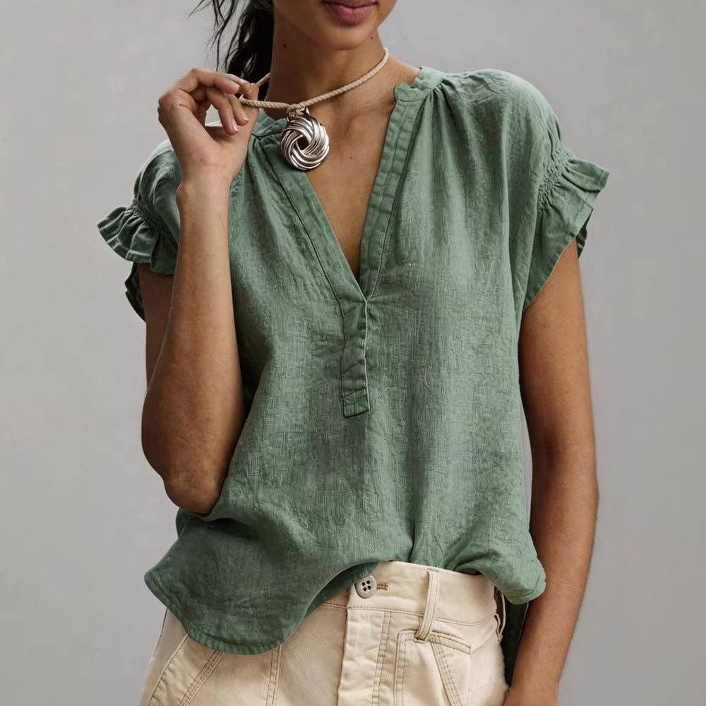 Women's blouse featuring a stylish V-neck and ruffle sleeves, designed for a relaxed fit in lightweight linen, perfect for summer wear. 2