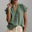 Women's blouse featuring a stylish V-neck and ruffle sleeves, designed for a relaxed fit in lightweight linen, perfect for summer wear. 2