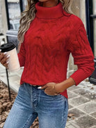 Women's cable-knit turtleneck sweater featuring a relaxed fit, perfect for cozy warmth during autumn and winter seasons. 1
