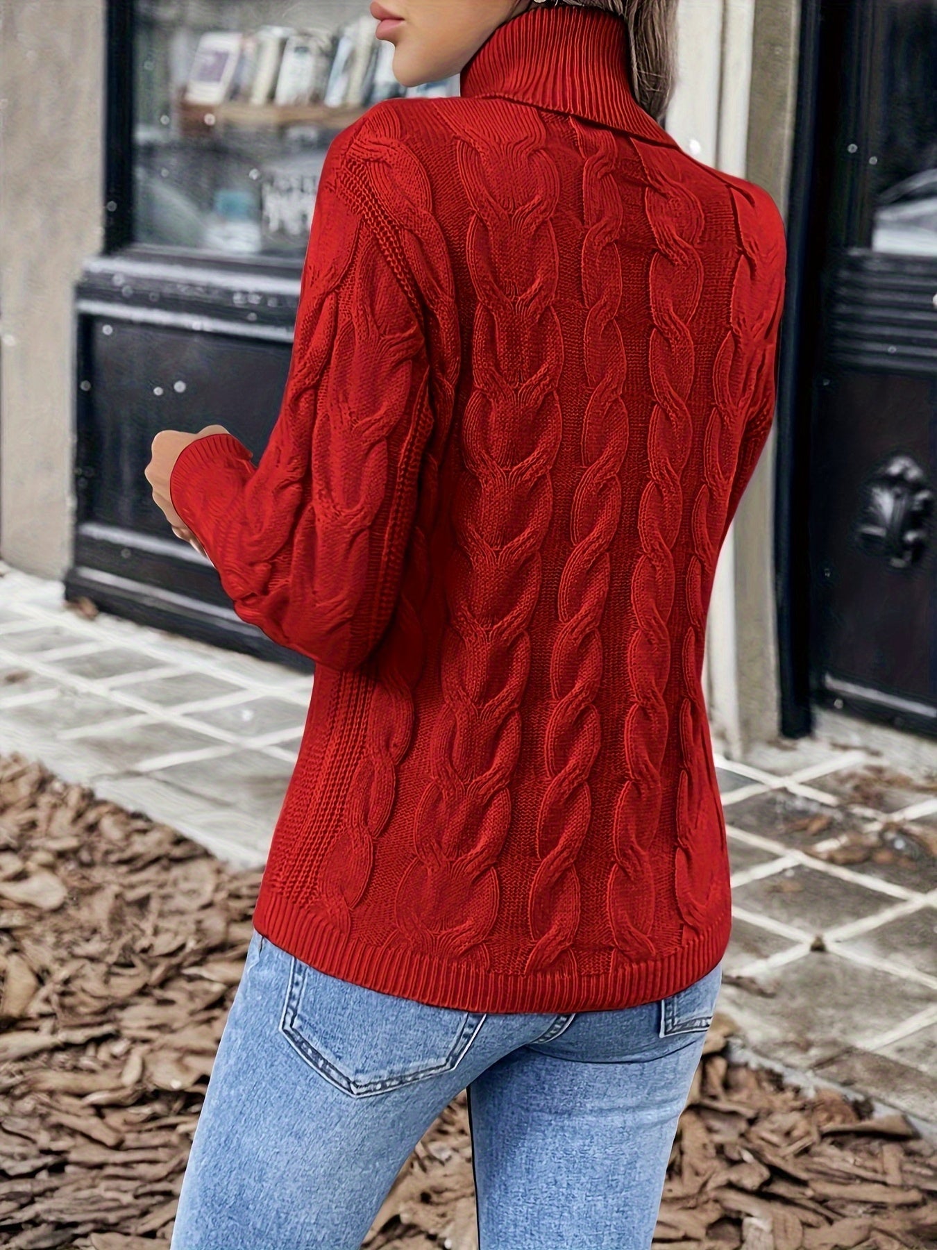 Women's cable-knit turtleneck sweater featuring a relaxed fit, perfect for cozy warmth during autumn and winter seasons. 2