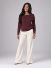 Women's cable knit sweater featuring button shoulder detail, crew neck design, and a stylish diamond knit pattern in a cozy and fashionable look. 2
