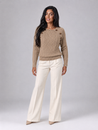 Women's cable knit sweater featuring button shoulder detail, crew neck design, and a stylish diamond knit pattern in a cozy and fashionable look. 4