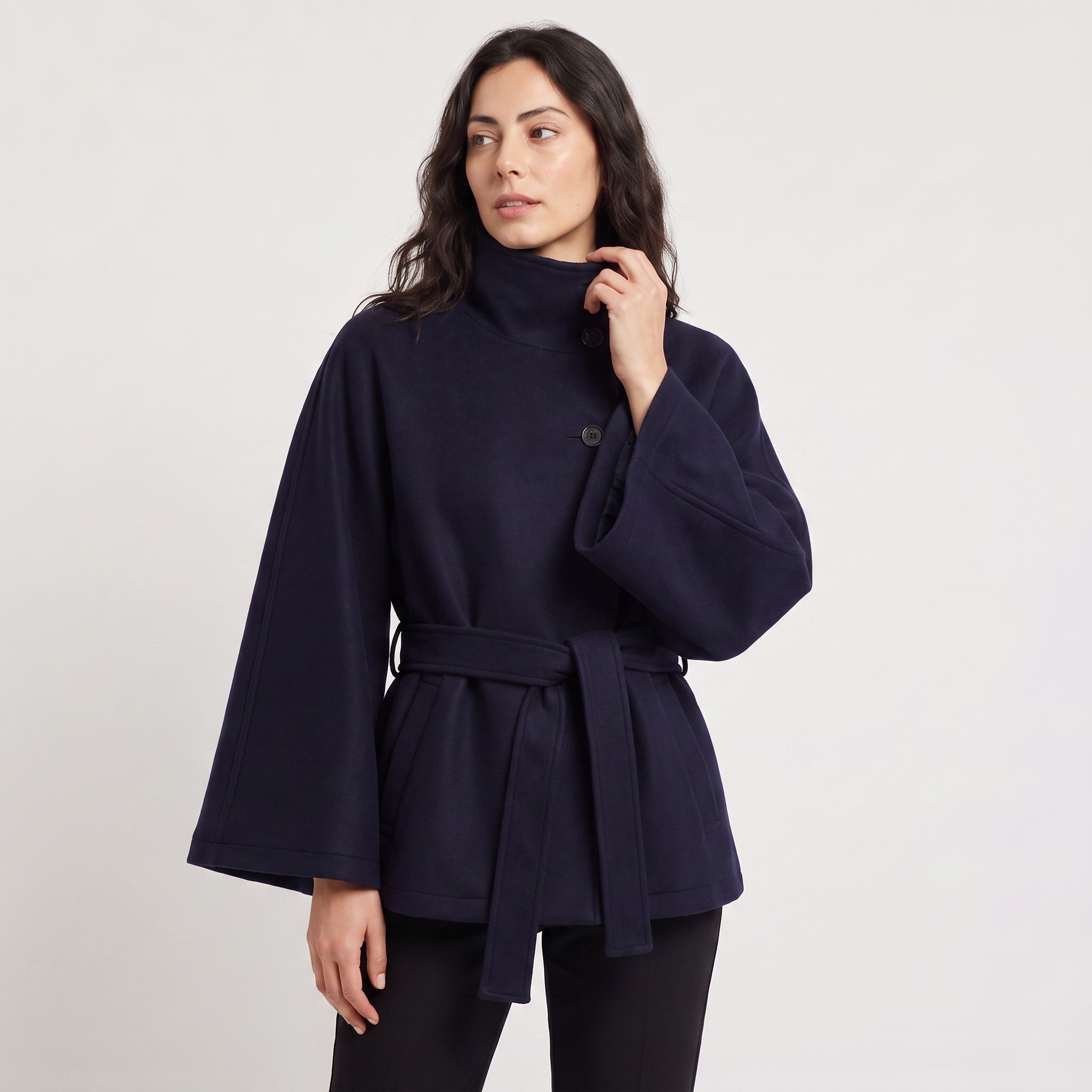 Women's oversized winter coat featuring a high collar and adjustable belt, designed for warmth and style, perfect for cold weather fashion. 0