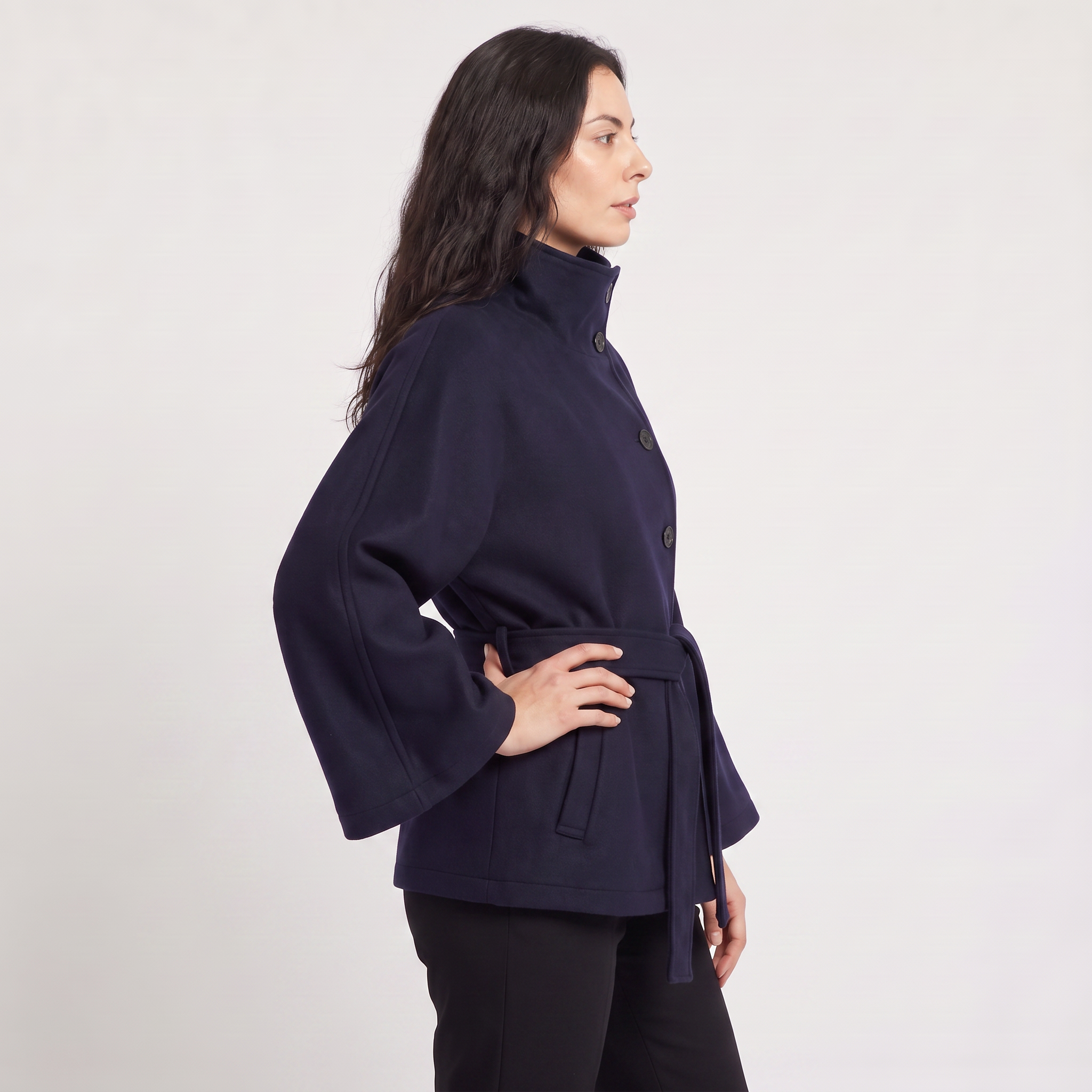 Women's oversized winter coat featuring a high collar and adjustable belt, designed for warmth and style, perfect for cold weather fashion. 3