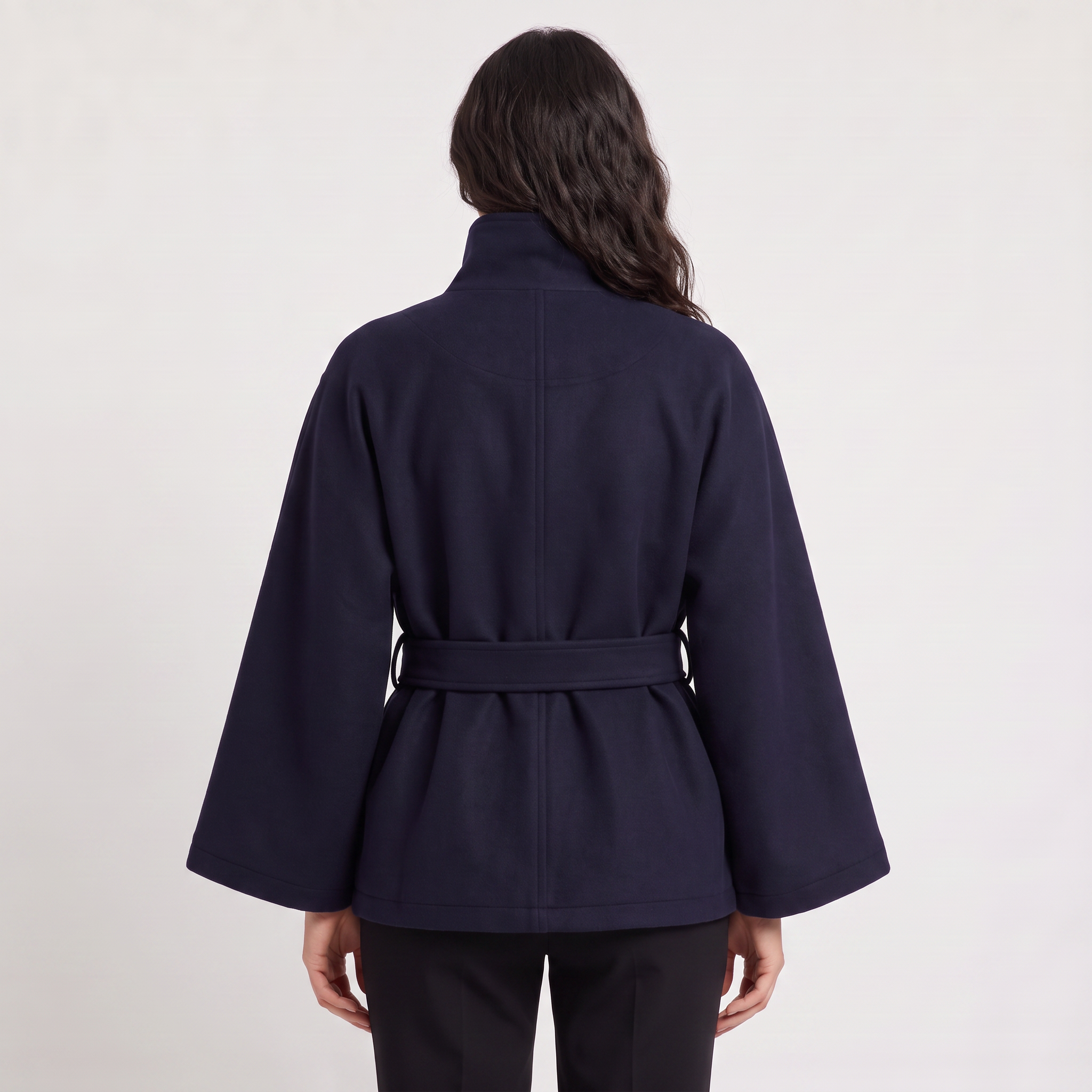 Women's oversized winter coat featuring a high collar and adjustable belt, designed for warmth and style, perfect for cold weather fashion. 4